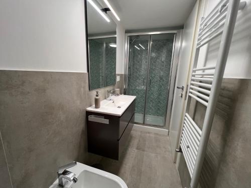 a bathroom with a sink and a toilet and a mirror at Camogli - Il Caruggio di Mirella - Liguria Holidays in Camogli