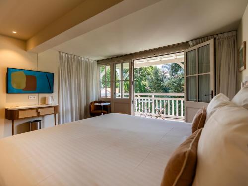Cama ou camas em um quarto em La Villa du Moulleau