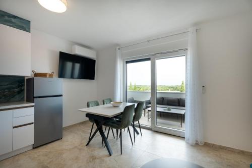 Η κουζίνα ή μικρή κουζίνα στο Apartmani Iman