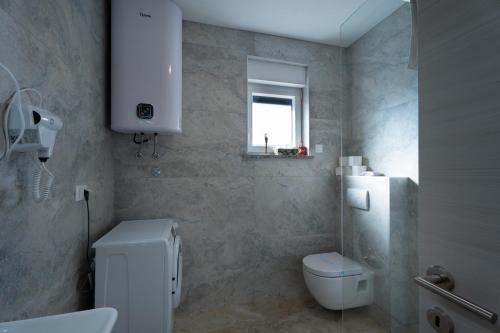 Ένα μπάνιο στο Apartmani Iman