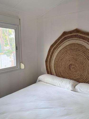 a bedroom with a bed and a window at Camping Moraira in Moraira