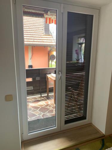 a sliding glass door with a view of a room at Udoben, razkošen, sončen apartma, 5 min do avtoceste in Orehova vas 