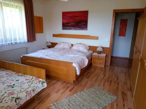 Posteľ alebo postele v izbe v ubytovaní Haus Christof private Ferienwohnungen Nähe Wörthersee und Ossiacher See