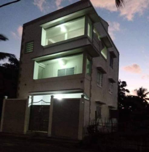 a tall building with windows on the side of it at Chez Pauline in Sainte Marie