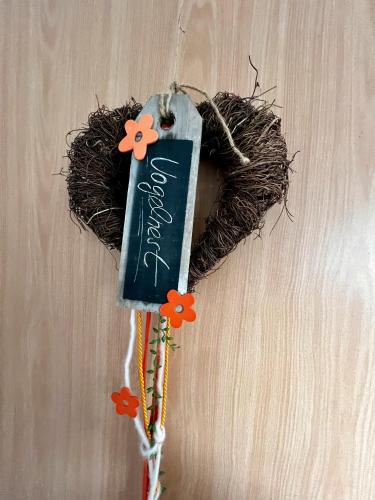 a bird nest with a sign on a wall at Vogtadeshof in Wolfach