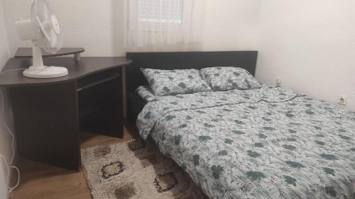 A bed or beds in a room at Apartmani Leonida 3 Trebinje