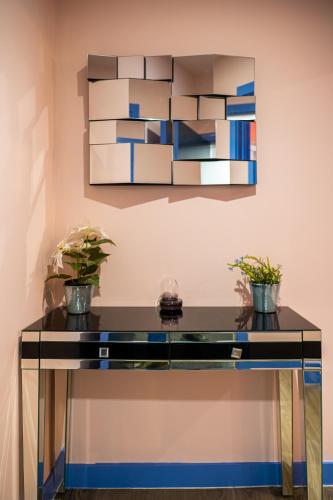a glass table with two potted plants on it at Prime Serviced Apartments Sheffield Center in Sheffield