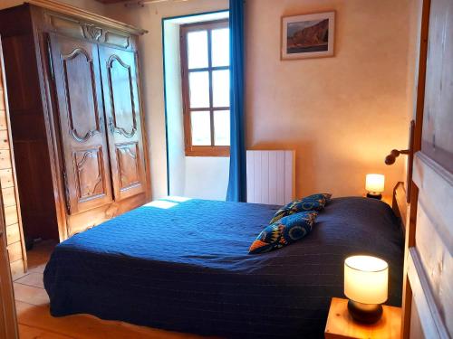 Una cama o camas en una habitación de Gîte du Grand Delmas