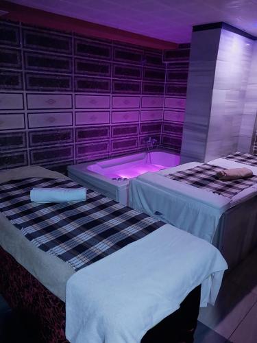 Postel nebo postele na pokoji v ubytování Sea City Devran Hotel & Spa