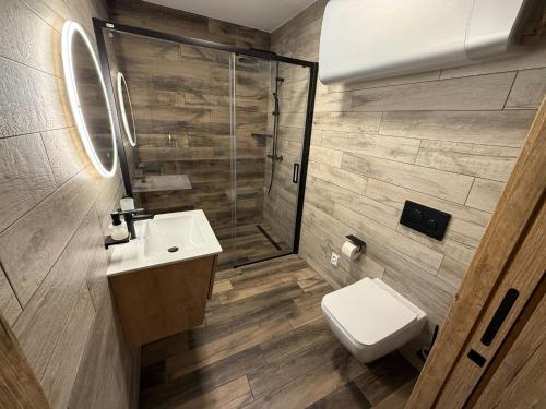 a bathroom with a toilet and a sink and a shower at Sklep "OSUD" in Mutěnice
