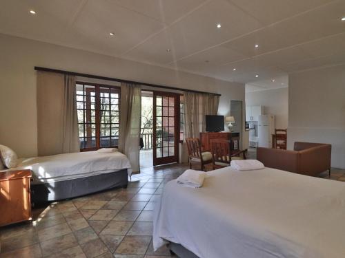 Ένα ή περισσότερα κρεβάτια σε δωμάτιο στο Aintree Lodge