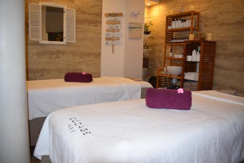 Katil atau katil-katil dalam bilik di La Loggia Appart'Hôtel & Spa