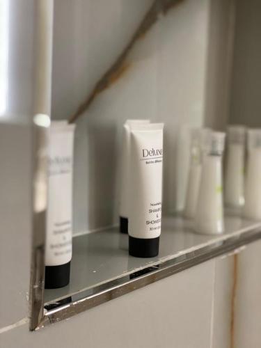 a shelf with two white products on it at Nettuno Resort Orikum in Orikum