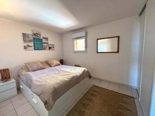 Ένα ή περισσότερα κρεβάτια σε δωμάτιο στο Valras'Loc - The Wave Terrace