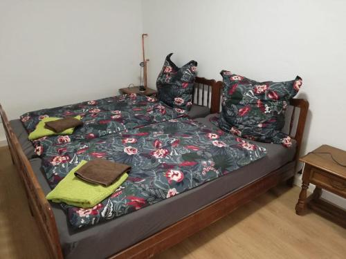 a bed with pillows and a blanket on it at Ferienwohnung am Halbmond in Badbergen