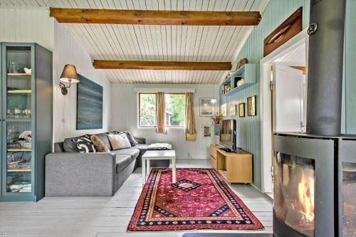 a living room with a couch and a fireplace at R746-Rodvig-Kaspervej-4 in Rødvig