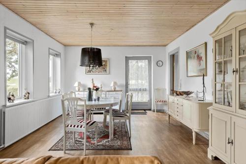 a dining room with a table and chairs at 4015-Stege-Sondre-Landevej-19 in Stege