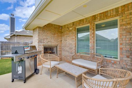 a patio with chairs and a grill on a house at 14 Mi to Dtwn OKC Quiet Yukon Gem in Yukon