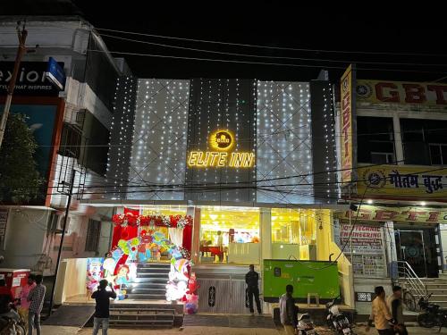 a store with a christmas display in front of it at Hotel Elite rooms & Banquet in Prayagraj