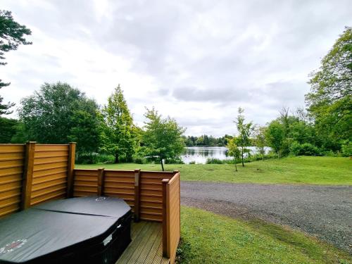 a wooden bed sitting on the side of a road at Oak Lodge 10 Hot Tub in York