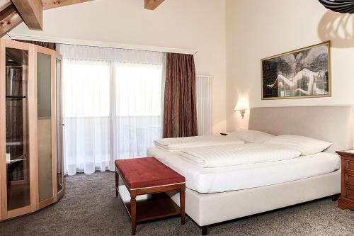 Postel nebo postele na pokoji v ubytování Hotel Gramaser
