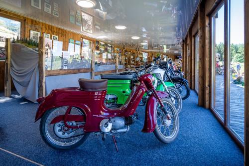 a row of motorcycles parked in a building at Apartmány Ski Telgárt - Telgárt Resort in Telgárt
