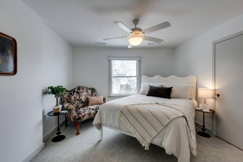 a bedroom with a bed and a ceiling fan at Alley Loft In 12 South Park Free in Nashville