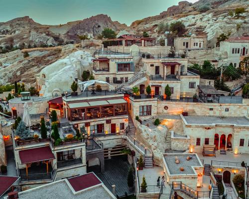 an aerial view of a town with a mountain at Utopia Cave Cappadocia in Urgup