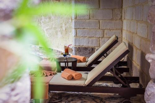 a patio with two chairs and a table at Utopia Cave Cappadocia in Urgup