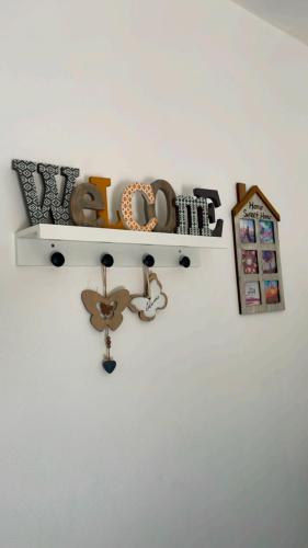 a shelf on a wall with a bunch of items at DIMORA MELISSA in Colà di Lazise