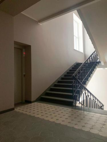 a staircase in an empty building with a window at Residential Barona Apartments in Riga Centre in Rīga