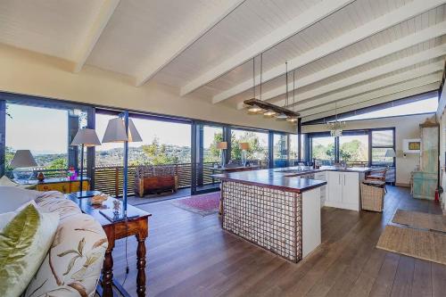 a large room with a kitchen and a living room at Table Mountain Villa in Cape Town