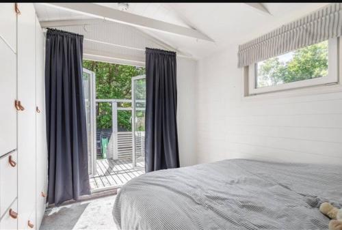 Ένα ή περισσότερα κρεβάτια σε δωμάτιο στο Mysig stuga