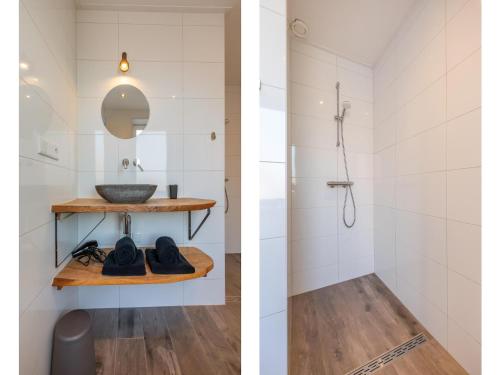 a bathroom with a sink and a shower at Lovely, modern, 4-person apartment in the heart of Koudekerke in Koudekerke