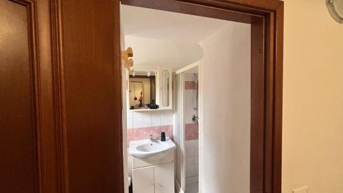 a bathroom with a sink and a mirror at La Spezia stazione centrale - via dei colli in La Spezia
