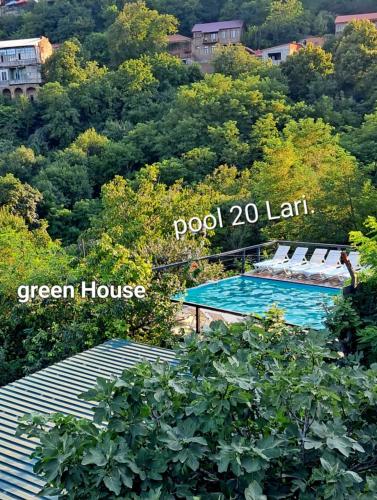 a sign that reads pool left and a green house at Green House მწვანე სახლი in Sighnaghi