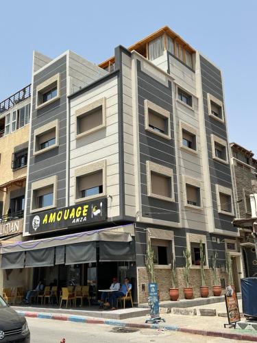 a gray building with a sign that reads ambulance at Amouage Anza - Sea View Apartments in Agadir