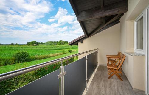 a balcony with a view of a green field at 2 Bedroom Cozy Home In Duga Resa in Duga Resa