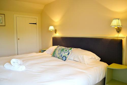 Ένα ή περισσότερα κρεβάτια σε δωμάτιο στο Cardross Holiday Cottages