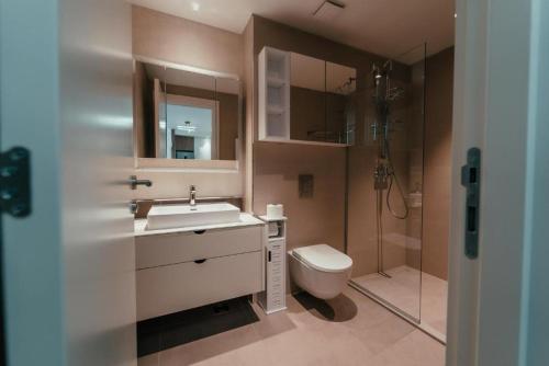 a bathroom with a sink and a toilet and a shower at BW City Elegance Collection in Belgrade