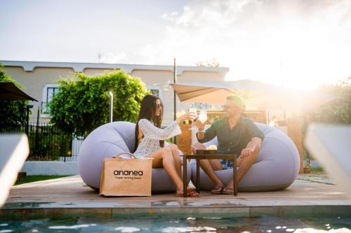 a man and a woman sitting in an inflatable limbo at ananea Tropea Yachting Resort in Tropea