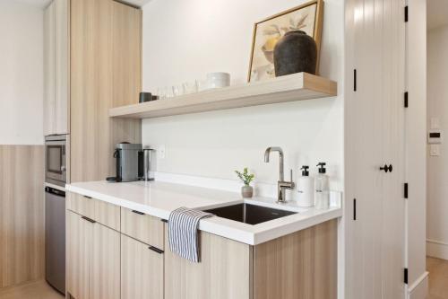 a kitchen with a sink and a counter at Casa Riviera - Boutique Suites in Downtown Santa Barbara in Santa Barbara