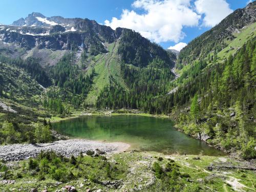 a lake in a valley in the mountains at Chalet BRUNNHÄUSL in Hüttschlag