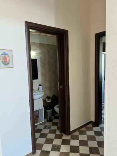 a bathroom with a toilet and a sink at THALASSA Seafront in Vrontados