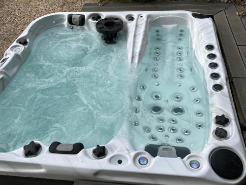 a jacuzzi tub with water in it at Maison du soleil in Mérindol-les-Oliviers