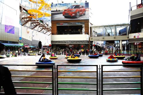 a group of people riding in tubes down a city street at Stay Park 1 in Goyang