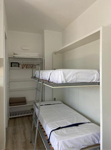 a room with two bunk beds in a room at Residence Intur in Marciana Marina