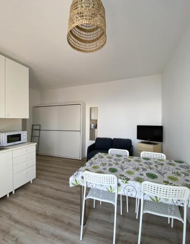 a living room with a table and a couch at Residence Intur in Marciana Marina