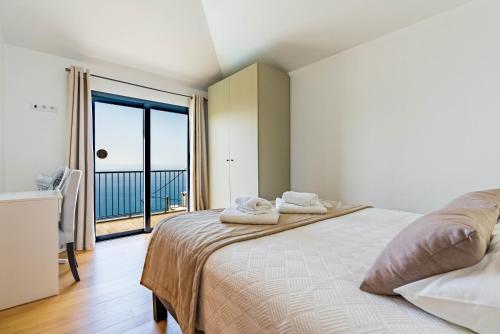 Postel nebo postele na pokoji v ubytování Villa da Bisa with heated swiming pool