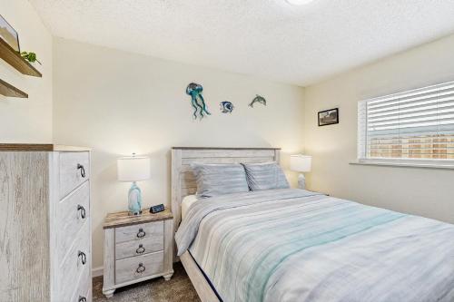 a bedroom with a bed and a window at Mad River Retreat in McKinleyville